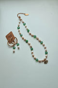 Pearl necklace with green evil eye beads and earings