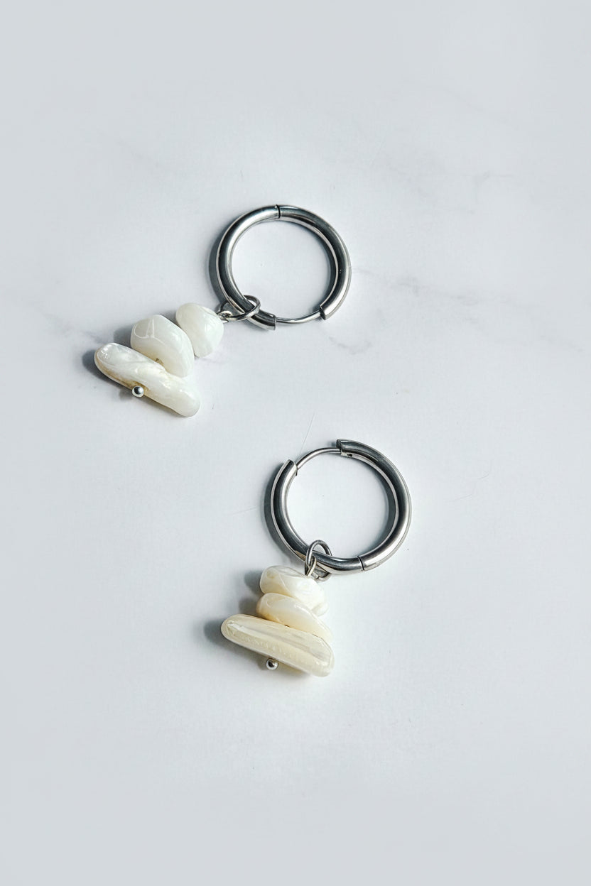 Silver hoop earrings with seashell beads