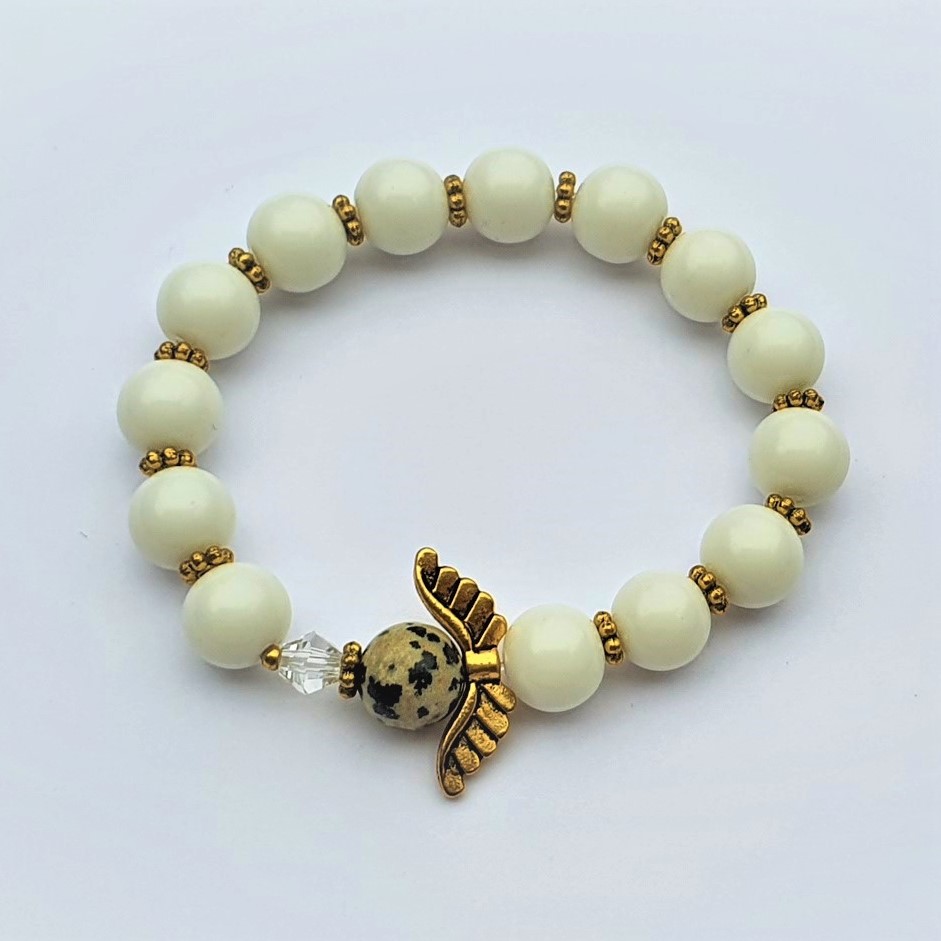 White bracelet with gold spacers