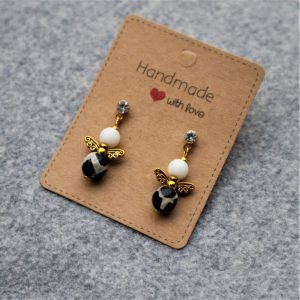 Black and white angel earrings