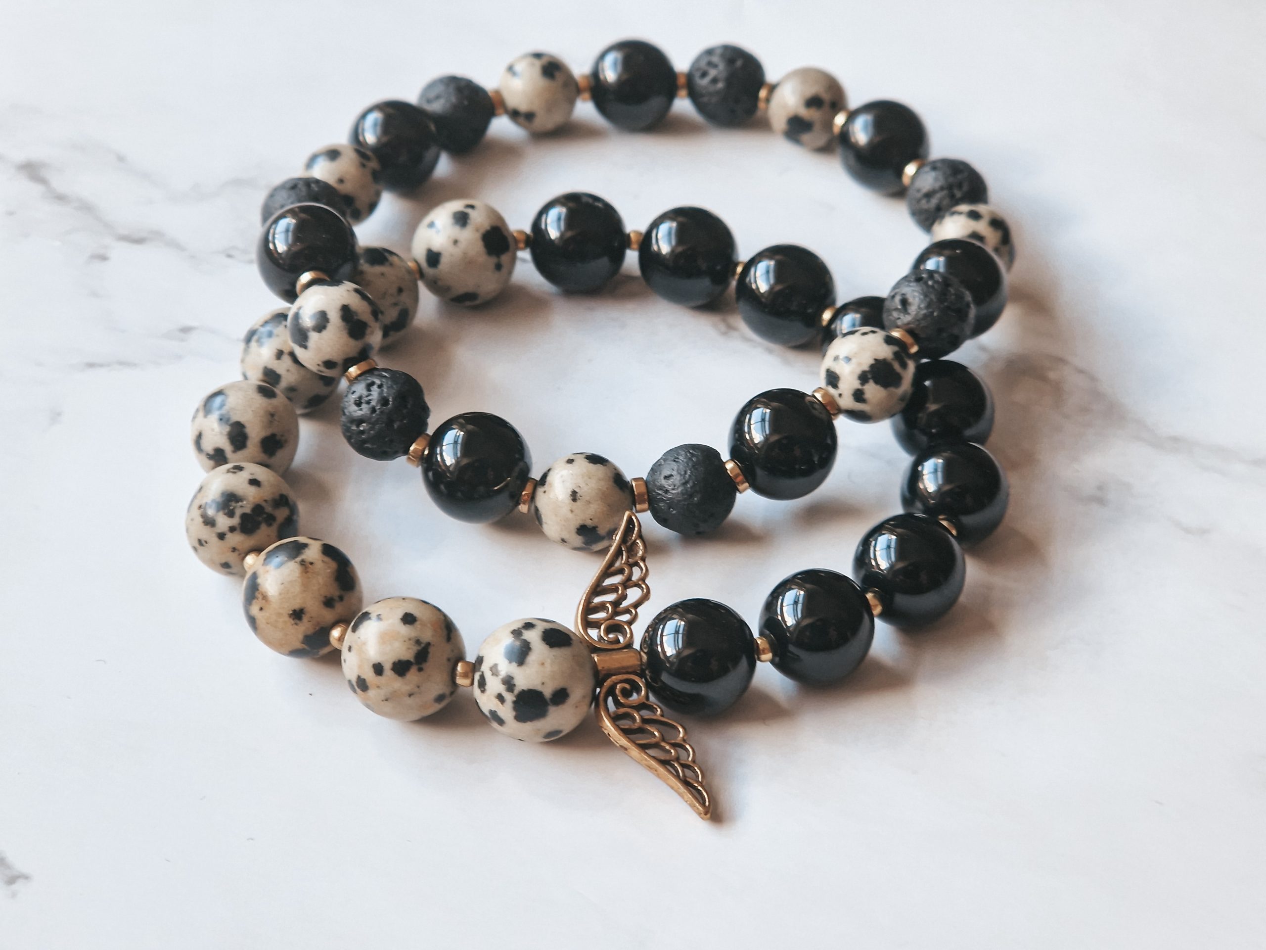 Black and spotted beads bracelets set