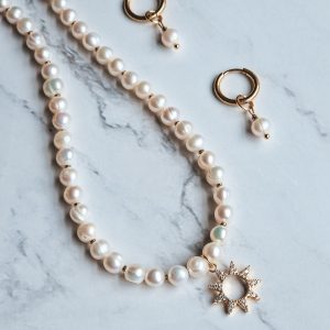 Freshwater pearl necklace with star sun pendant